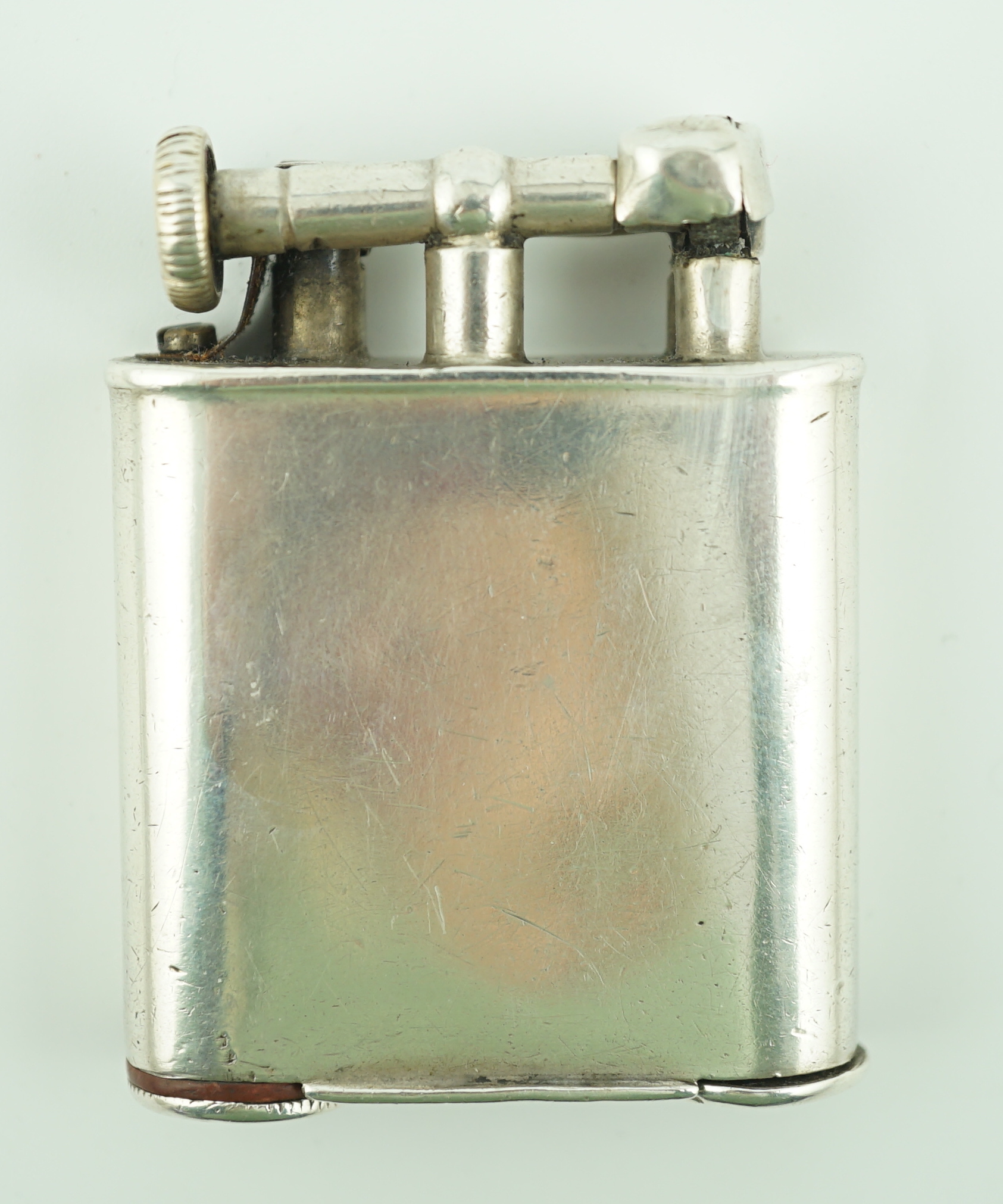 A George V silver novelty lighter, with two colour enamelled panel of 'The People' newspaper front cover dated May 5th, 1929